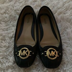 Black MK flats